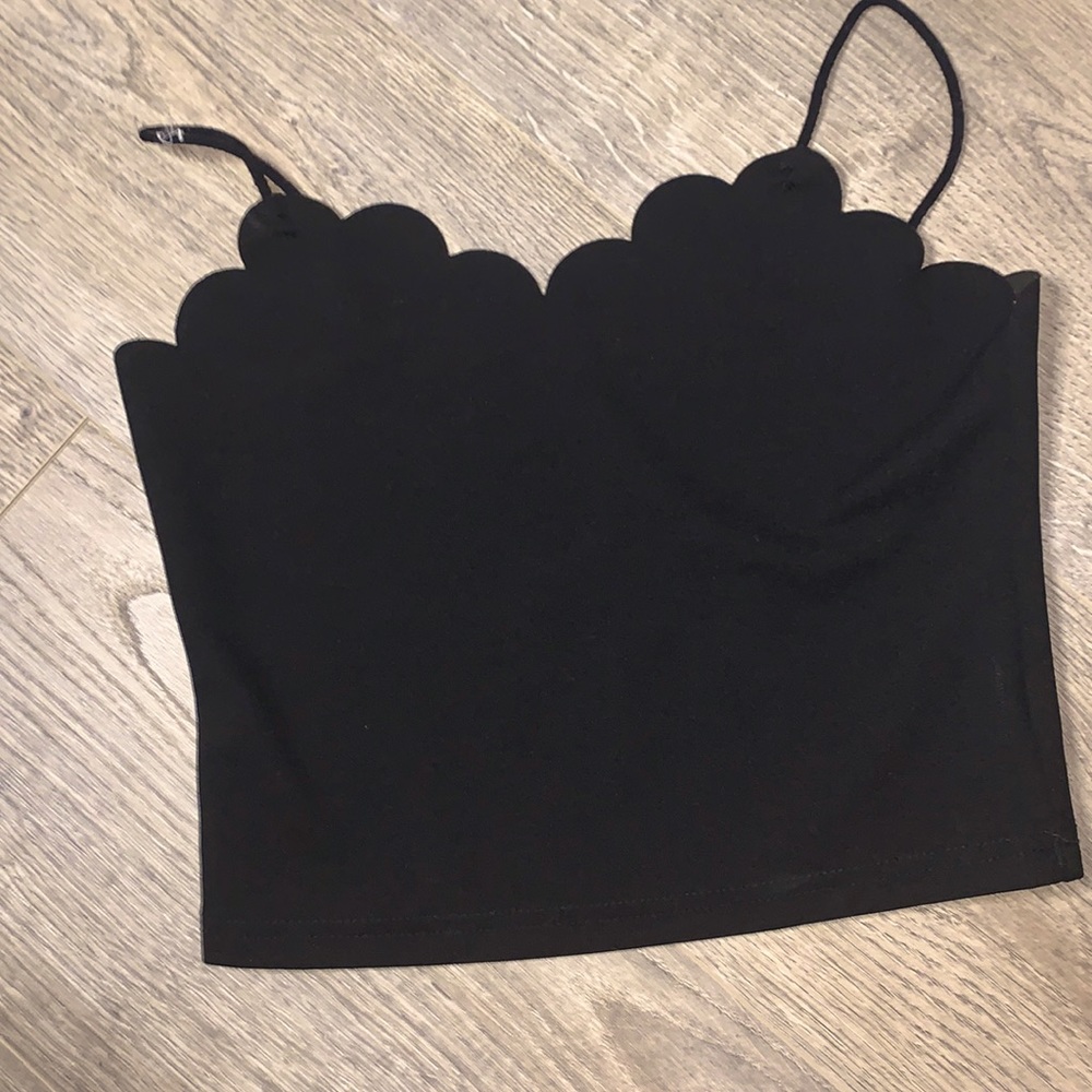 A black top with small straps.